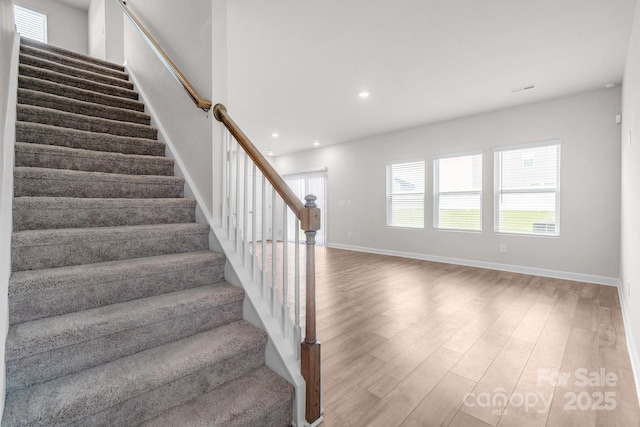 1022 Jeffery Dean Ct, Albemarle, NC 28001 - stairway with wood finished floors, healthy amount of natural light, and recessed lighting