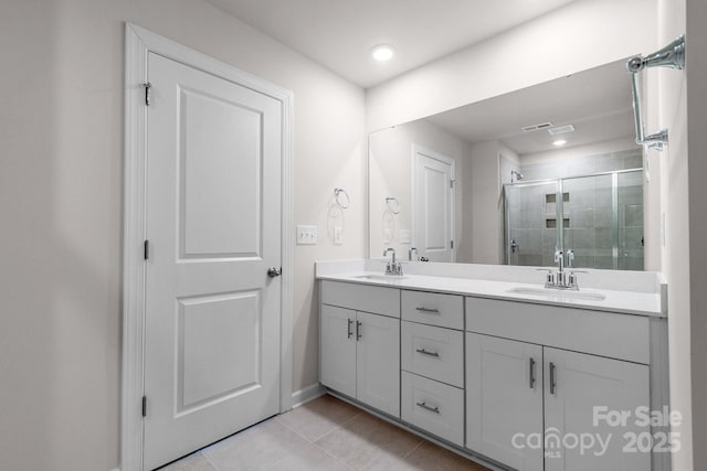 1022 Jeffery Dean Ct, Albemarle, NC 28001 - bathroom with double vanity, tile patterned floors, and a stall shower