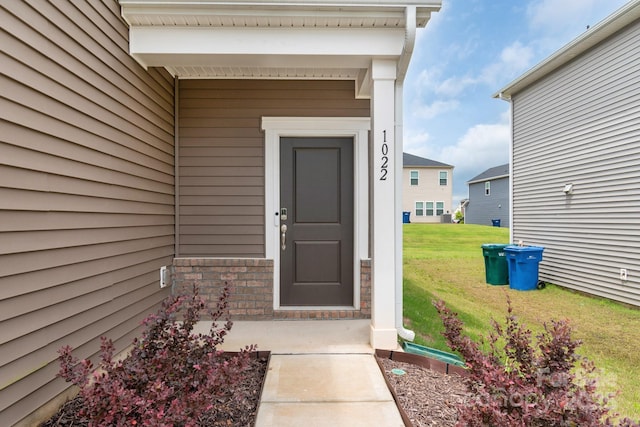 1022 Jeffery Dean Ct, Albemarle, NC 28001 - view of exterior entry with a yard