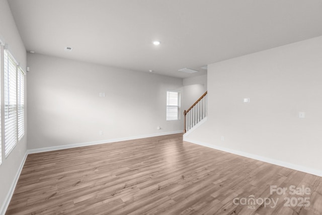 1022 Jeffery Dean Ct, Albemarle, NC 28001 - unfurnished living room featuring light wood-style floors, stairs, and recessed lighting