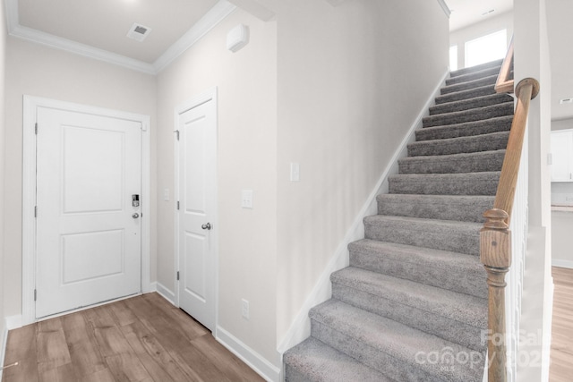 1022 Jeffery Dean Ct, Albemarle, NC 28001 - stairway featuring crown molding and wood finished floors