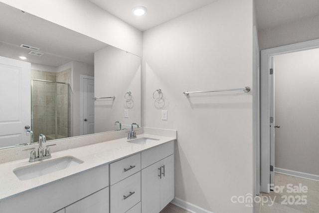 1022 Jeffery Dean Ct, Albemarle, NC 28001 - bathroom featuring double vanity, a stall shower, and tile patterned floors