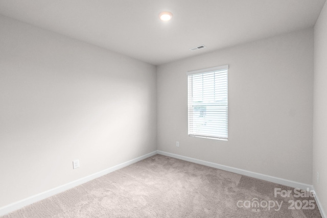 1022 Jeffery Dean Ct, Albemarle, NC 28001 - spare room featuring baseboards and light colored carpet