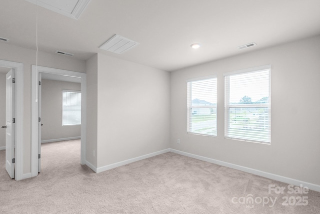 1022 Jeffery Dean Ct, Albemarle, NC 28001 - spare room featuring carpet floors, healthy amount of natural light, and attic access