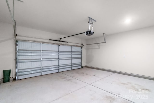 1022 Jeffery Dean Ct, Albemarle, NC 28001 - garage featuring baseboards and a garage door opener