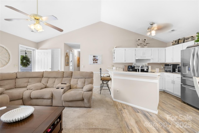 2490 Hawk Ridge Dr, Gastonia, NC 28056 - living room featuring a ceiling fan, light wood-type flooring, and lofted ceiling