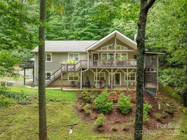 21 Fern Haven Ln, Fairview, NC 28730 - rear view of property with a deck, a shingled roof, stairway, a yard, and a patio area