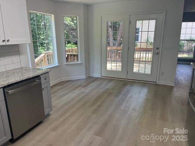 11021 Scrimshaw Ln, Charlotte, NC 28215 - entryway with light wood-type flooring and baseboards