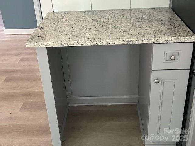 11021 Scrimshaw Ln, Charlotte, NC 28215 - detailed view of wood finished floors and baseboards