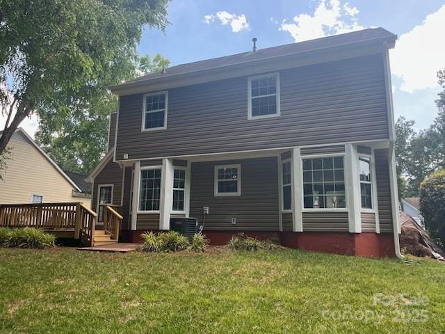 11021 Scrimshaw Ln, Charlotte, NC 28215 - back of property featuring a lawn and a wooden deck