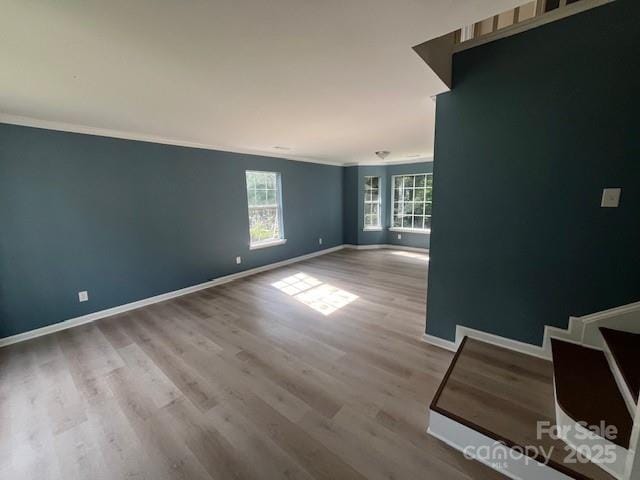 11021 Scrimshaw Ln, Charlotte, NC 28215 - unfurnished room featuring crown molding and wood finished floors