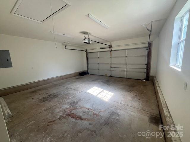 11021 Scrimshaw Ln, Charlotte, NC 28215 - garage featuring electric panel and a garage door opener