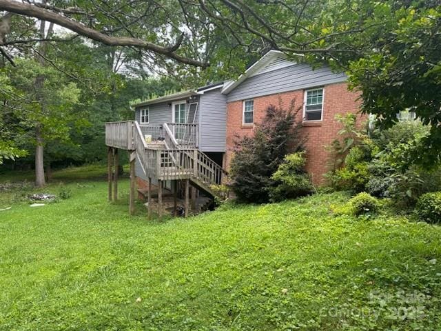 2116 Dana Pl, Shelby, NC 28152 - rear view of house featuring stairway, a deck, a yard, and brick siding