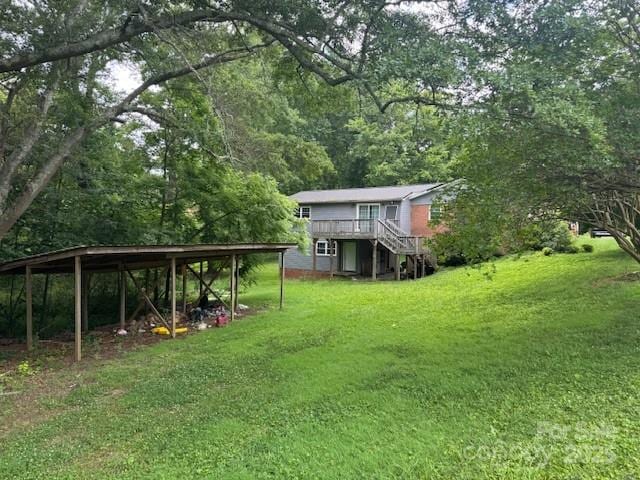 2116 Dana Pl, Shelby, NC 28152 - view of green lawn featuring stairway, a deck, and a forest view
