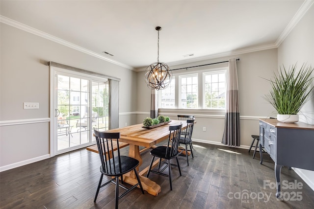 3041 Winged Teal Ct, Belmont, NC 28012 - dining area with healthy amount of natural light, ornamental molding, dark wood finished floors, and a chandelier