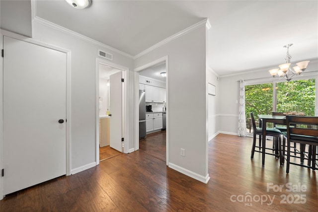 3500 Colony Rd Unit B, Charlotte, NC 28211 - corridor with dark wood-style floors, a chandelier, and crown molding