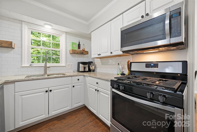 3500 Colony Rd Unit B, Charlotte, NC 28211 - kitchen with appliances with stainless steel finishes, crown molding, open shelves, decorative backsplash, and white cabinetry