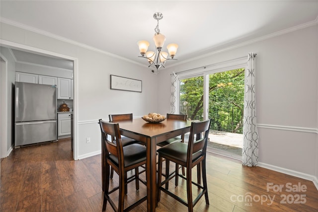 3500 Colony Rd Unit B, Charlotte, NC 28211 - dining space with a chandelier, dark wood-style floors, and crown molding