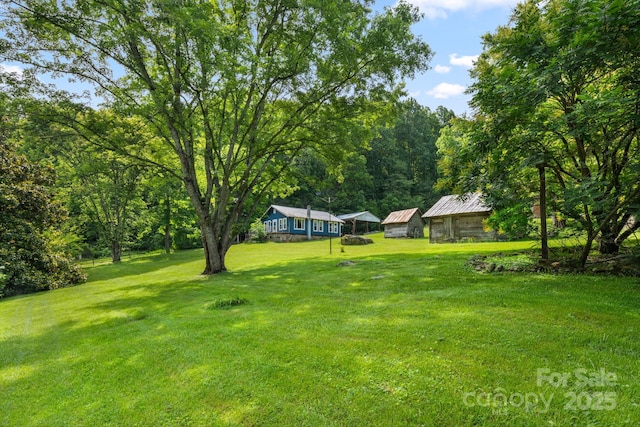2428 Hamburg Rd, Mars Hill, NC 28754 - view of grassy yard with a detached carport