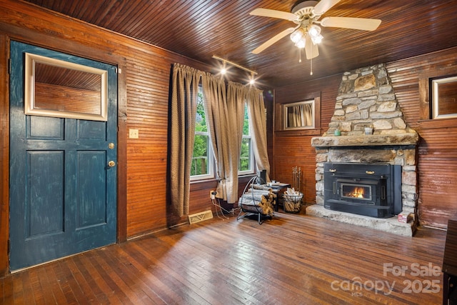 2428 Hamburg Rd, Mars Hill, NC 28754 - foyer entrance with hardwood / wood-style floors, wooden ceiling, a ceiling fan, wood walls, and a stone fireplace
