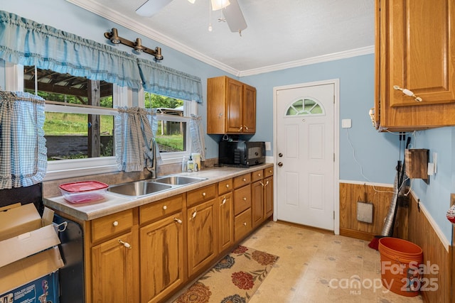 2428 Hamburg Rd, Mars Hill, NC 28754 - kitchen with black microwave, a wainscoted wall, ornamental molding, brown cabinets, and ceiling fan