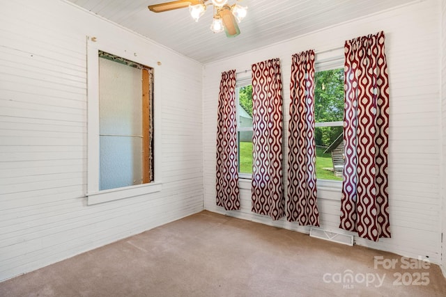 2428 Hamburg Rd, Mars Hill, NC 28754 - carpeted empty room featuring ceiling fan and wooden walls