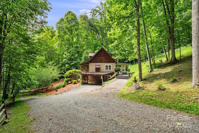1980 Old Murray Rd, Mars Hill, NC 28754 - rustic home with gravel driveway, a chimney, and a forest view