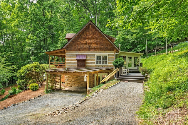1980 Old Murray Rd, Mars Hill, NC 28754 - rustic home featuring a carport, gravel driveway, french doors, and a wooden deck