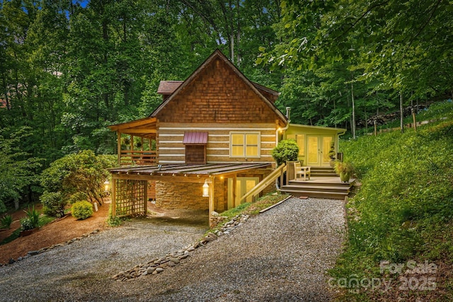 1980 Old Murray Rd, Mars Hill, NC 28754 - view of front of property with driveway, stone siding, a carport, and a forest view