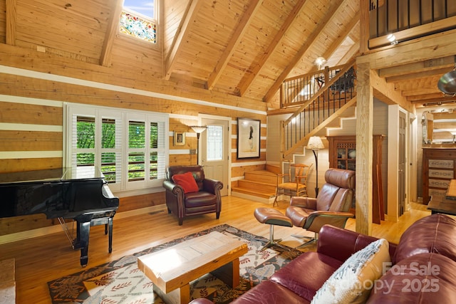 1980 Old Murray Rd, Mars Hill, NC 28754 - living room featuring wooden walls, wood finished floors, high vaulted ceiling, a wood ceiling with exposed beams, and stairway