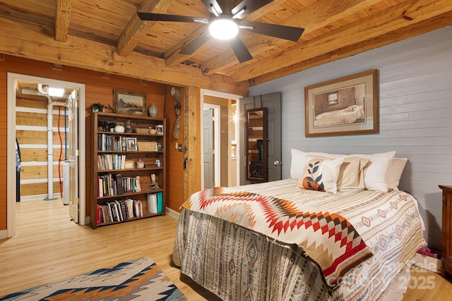 1980 Old Murray Rd, Mars Hill, NC 28754 - bedroom featuring wooden walls, light wood-type flooring, a wood ceiling with exposed beams, connected bathroom, and a ceiling fan