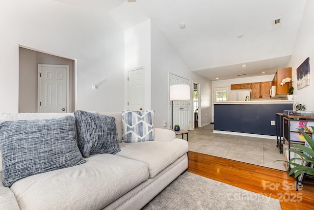 409 Lexie Ln, Rock Hill, SC 29732 - living room with high vaulted ceiling and light wood-style floors