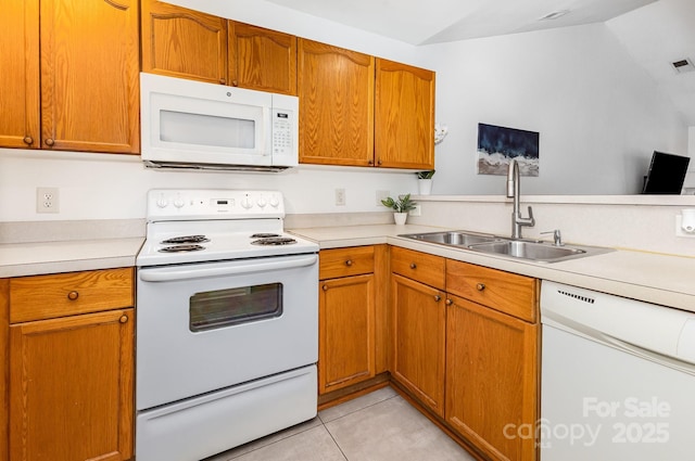 409 Lexie Ln, Rock Hill, SC 29732 - kitchen with white appliances, light countertops, lofted ceiling, light tile patterned floors, and brown cabinetry