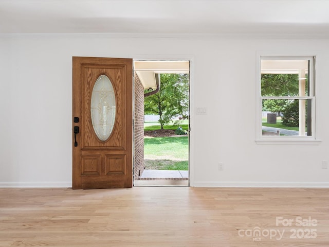 10728 Forest Dr, Matthews, NC 28105 - foyer with wood finished floors, ornamental molding, and healthy amount of natural light