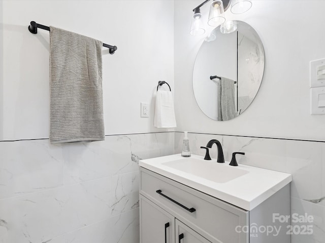 10728 Forest Dr, Matthews, NC 28105 - bathroom featuring tile walls, vanity, and a wainscoted wall