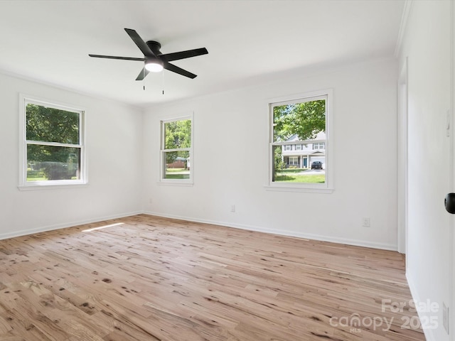 10728 Forest Dr, Matthews, NC 28105 - empty room with light wood-style floors and a ceiling fan