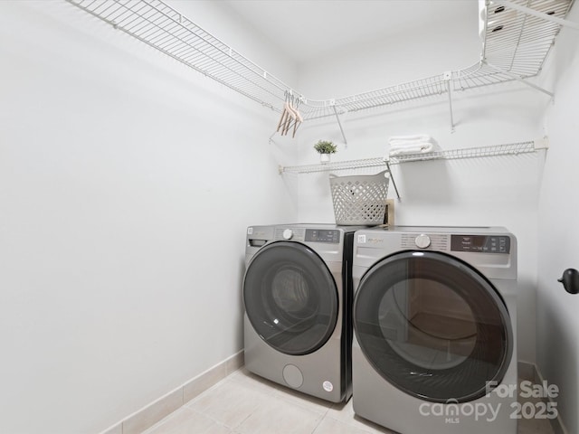 10728 Forest Dr, Matthews, NC 28105 - washroom featuring washing machine and clothes dryer and light tile patterned flooring