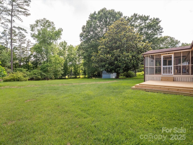 10728 Forest Dr, Matthews, NC 28105 - view of green lawn featuring a sunroom, a storage shed, and a deck