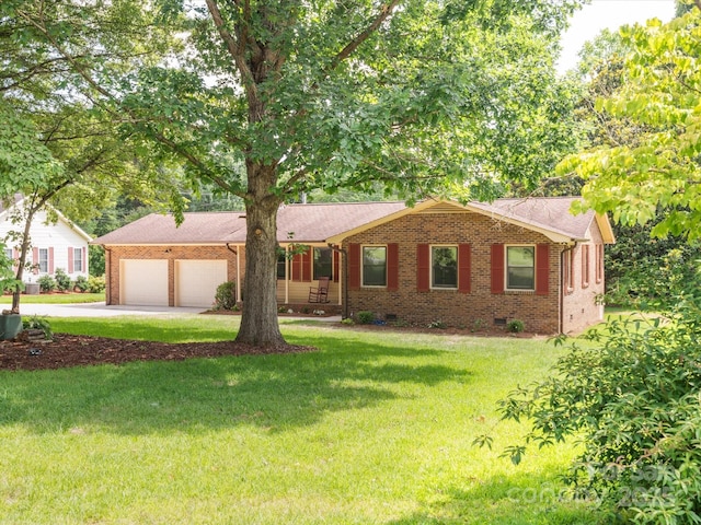 10728 Forest Dr, Matthews, NC 28105 - ranch-style home featuring brick siding, an attached garage, concrete driveway, and a front lawn
