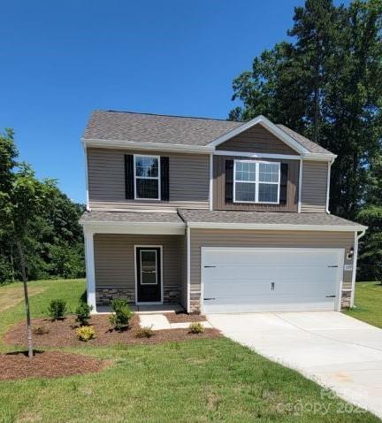 1059 Russell Dr, Winston Salem, NC 27127 - view of front facade featuring a garage, driveway, a front lawn, and covered porch