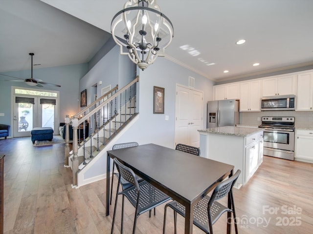 120 Prairie View Ct, Belmont, NC 28012 - dining room featuring a chandelier, light wood-style floors, stairs, recessed lighting, and ornamental molding