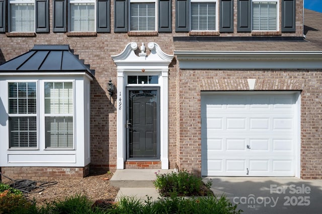 1498 Burrell Ave NW, Concord, NC 28027 - view of exterior entry featuring brick siding and roof with shingles