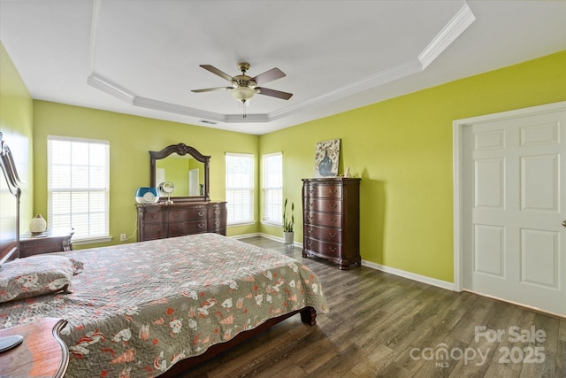 1498 Burrell Ave NW, Concord, NC 28027 - bedroom with a tray ceiling, wood finished floors, crown molding, and ceiling fan