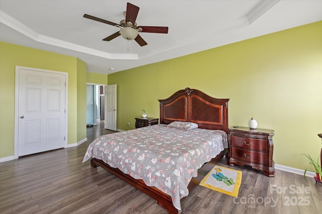 1498 Burrell Ave NW, Concord, NC 28027 - bedroom with wood finished floors, ornamental molding, a tray ceiling, and ceiling fan