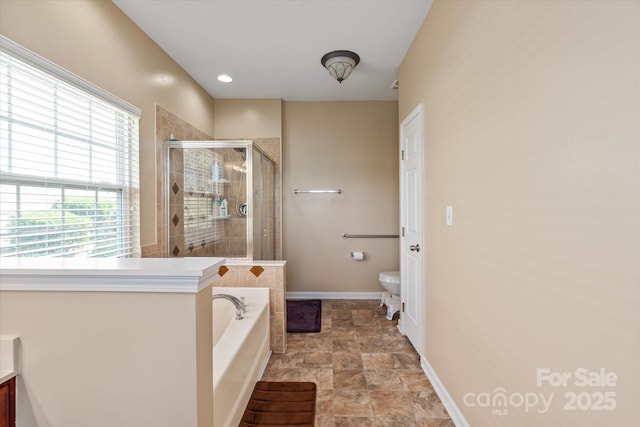 1498 Burrell Ave NW, Concord, NC 28027 - bathroom featuring a bath, a stall shower, stone finish flooring, and vanity