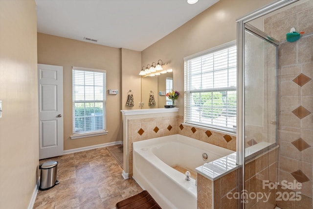 1498 Burrell Ave NW, Concord, NC 28027 - bathroom with a garden tub and a stall shower
