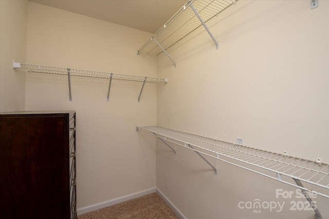 1498 Burrell Ave NW, Concord, NC 28027 - spacious closet featuring carpet floors