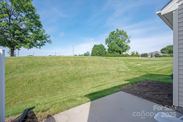 1498 Burrell Ave NW, Concord, NC 28027 - view of grassy yard with a patio area