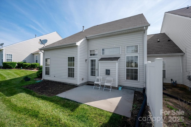 1498 Burrell Ave NW, Concord, NC 28027 - rear view of house featuring a patio, a yard, and roof with shingles
