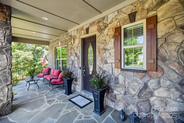 16547 Bastille Dr, Charlotte, NC 28278 - entrance to property featuring stone siding and covered porch